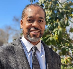 Paul Ransom smiles in a headshot, taken outside. Ransom is a Senior Technical Expert at the NTIA. Photo provided/Paul Ransom.