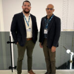 Larry Theran and Rafael Rodriguez Solis stand next to one another smiling.